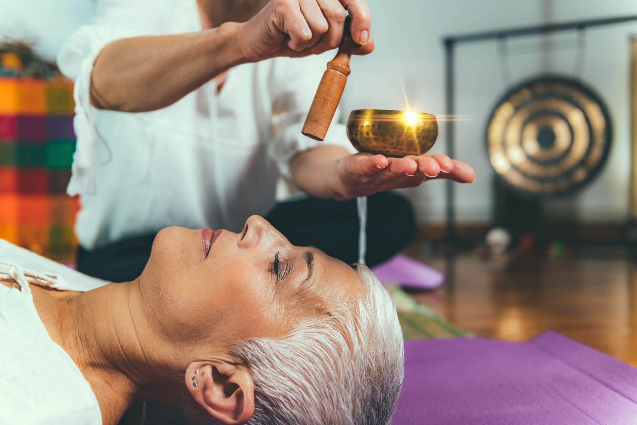 Sound healing involves various different sized bowls being played around your body